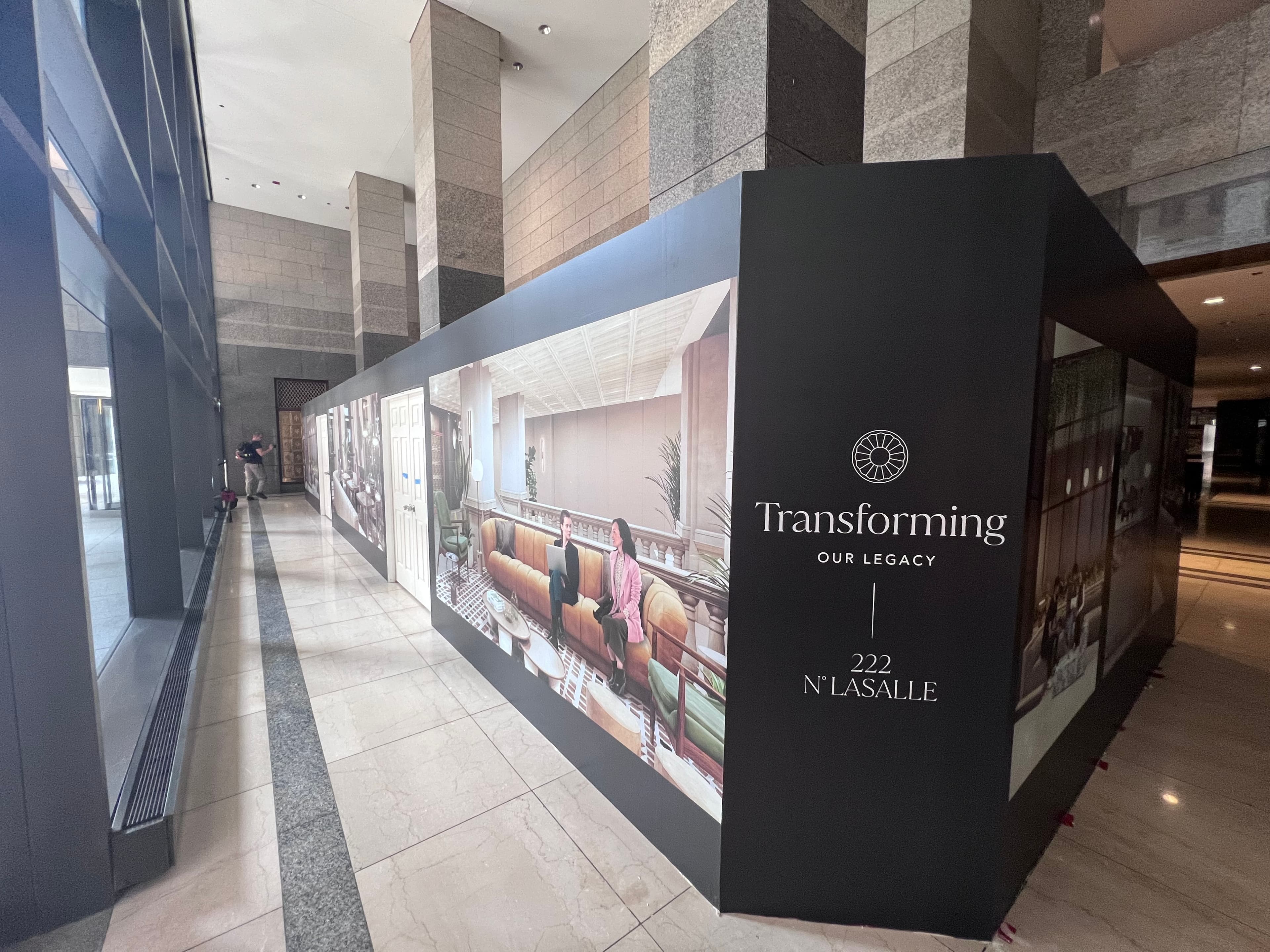 Hotel lobby barricade graphics installation – large-format wall wrap